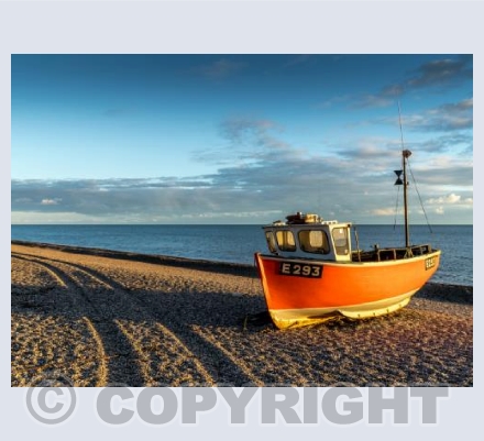 Boat at sunset on Branscombe Beach