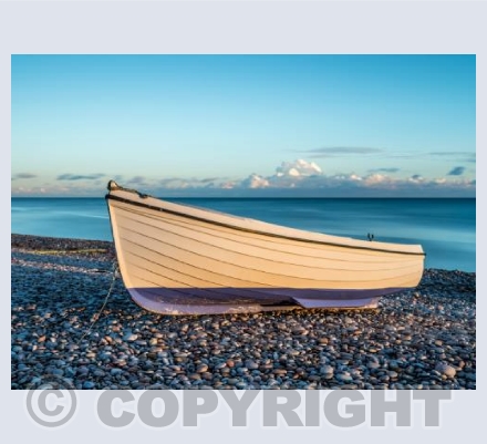 Boat at sunset on Budleigh beach