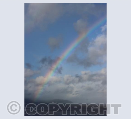 Rainbow in Blue Skies