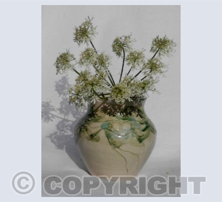 Green vase, white flowers