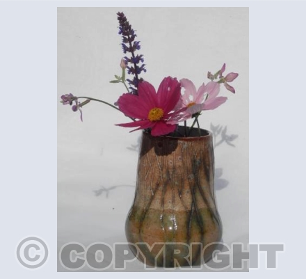 Stoneware vase with pink flowers