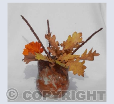 Vase with Autumn flowers and leaves