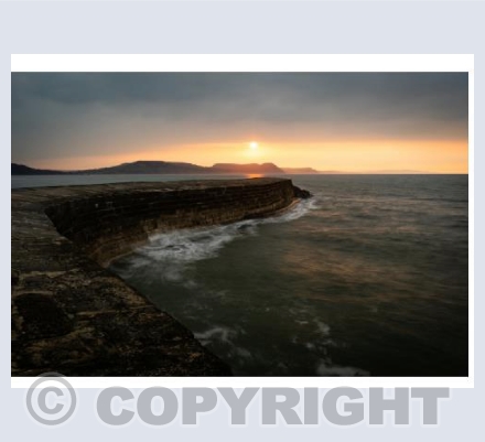 Sunrise over the Lyme Regis Cobb