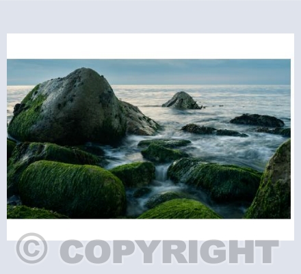 Waves over Jurassic Coast rocks