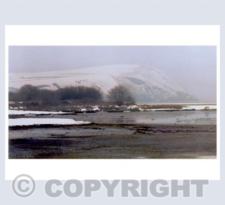 Dinas Head under a mantle of snow.